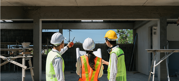 Construction workers discussing building plans.